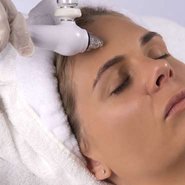 A woman having an Aqua Glow treatment.