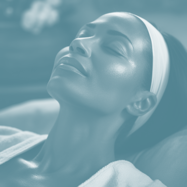 a woman receiving a luxurious facial treatment