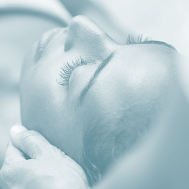 a woman receiving a luxurious facial treatment
