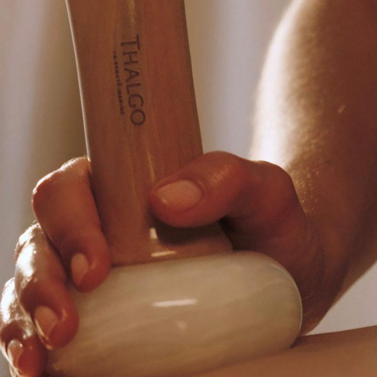 Thalgo spa stone massage with white jade pebble