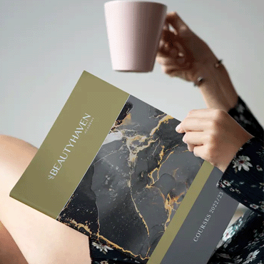 A Woman reading a brochure of courses